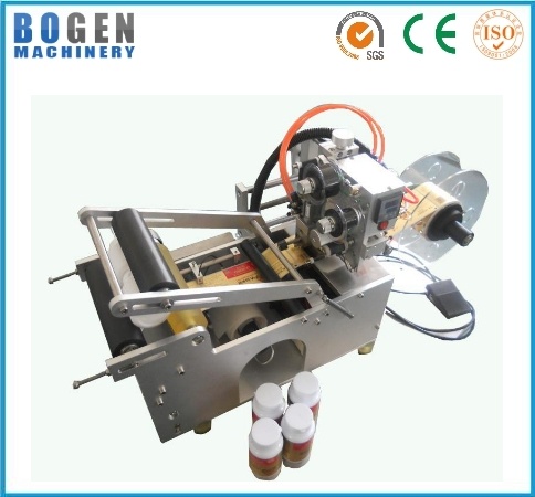 Semi-automatic round bottle labeling and coding machine