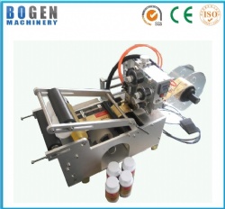 Semi-automatic round bottle labeling and coding machine